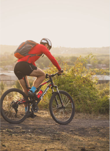 Man biking on slag heaps portrait